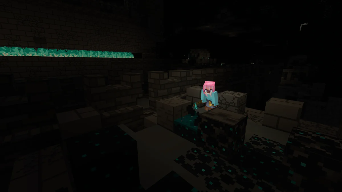 Player carrying a light source while exploring a dark Minecraft ancient city