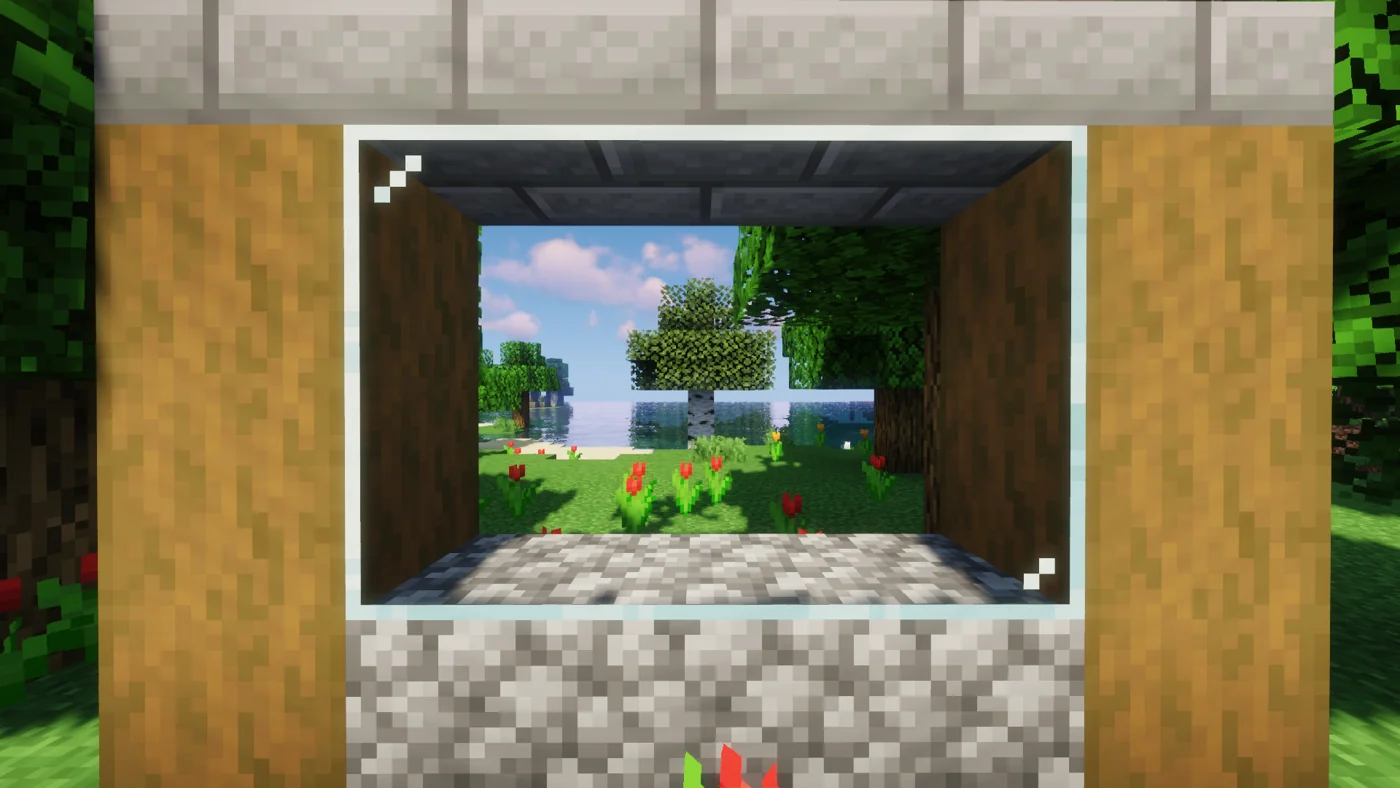 A connected glass window overlooking trees and the sea