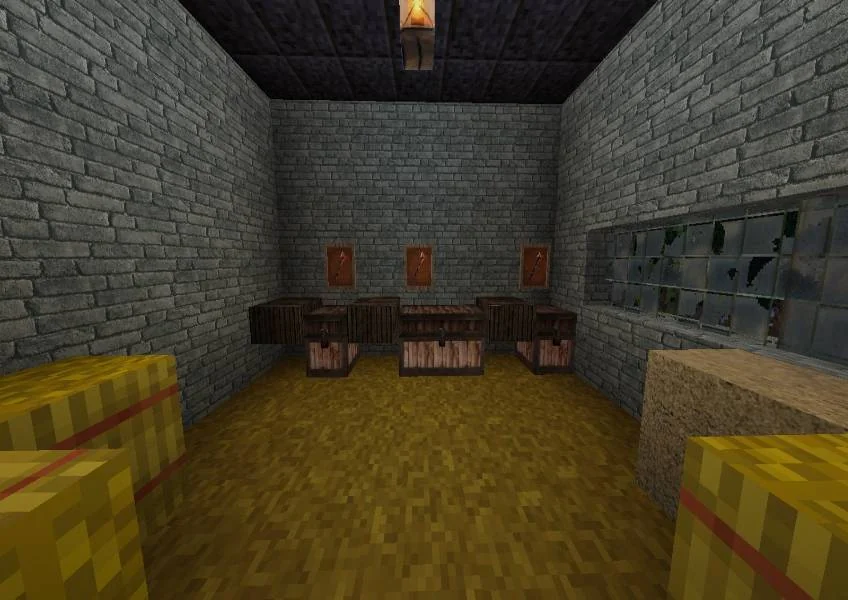 A stone-walled room with furniture, hay bales and a ceiling lantern