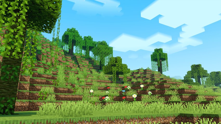 Green hillside with trees and white clouds in daylight