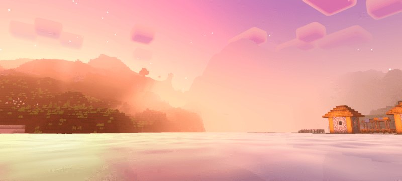 Orange sunrise across pale water toward hills and a small house