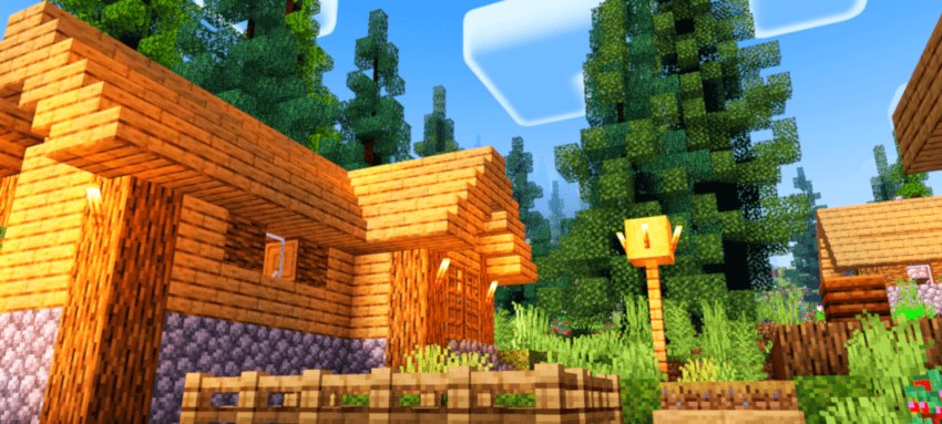 Warm daylight on wooden village houses and a fenced crop plot