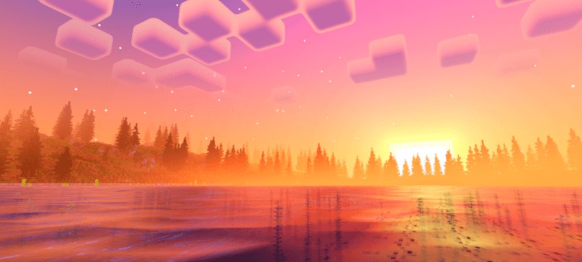 Pink sunset reflected across a lake with trees on the far shore