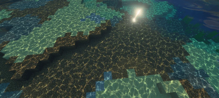 Bright caustic patterns on submerged blocks near a stepped shore
