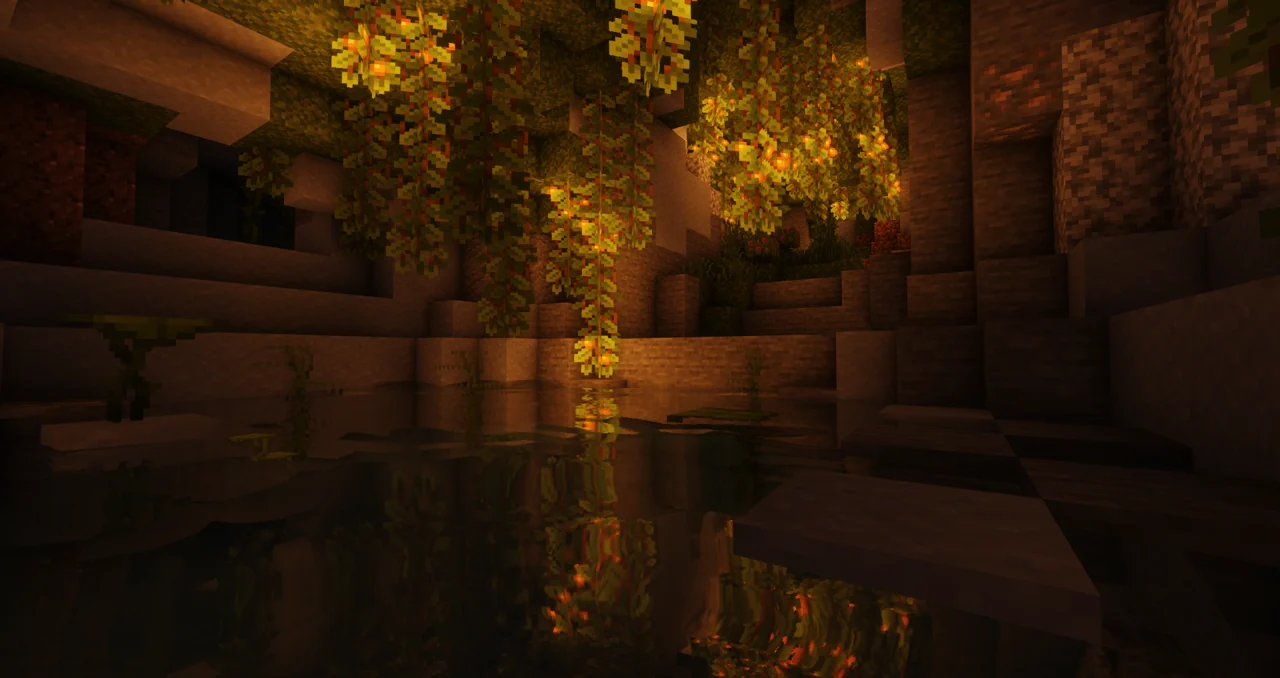 Lush cave pool reflecting warm light beneath hanging vines