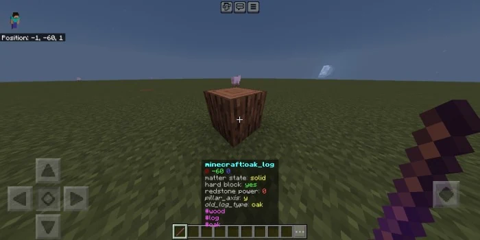 Early Debug Stick Block Viewer example showing an oak log and its properties above the hotbar