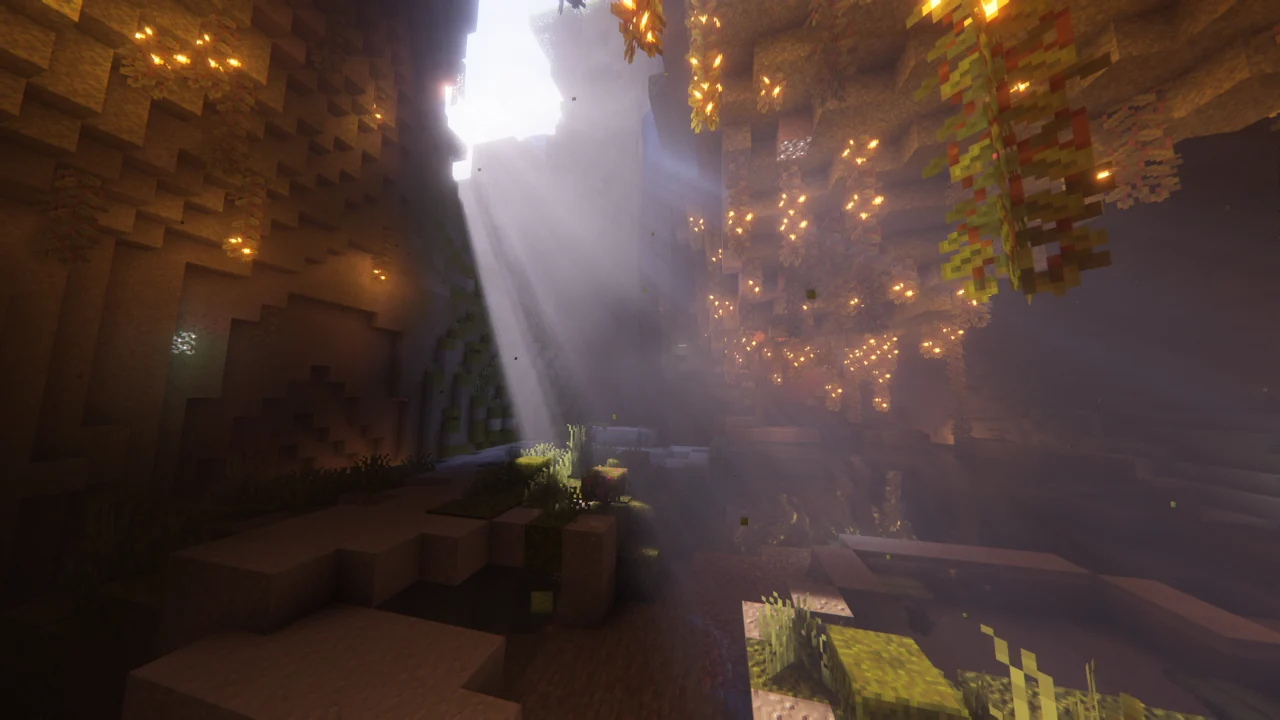 Sunlight reaching into a large lush cave with warm highlights