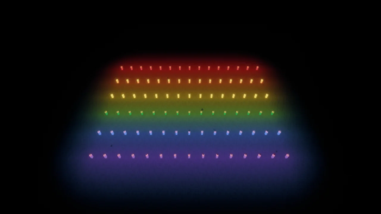 Rows of colored light sources illuminating a dark room with rainbow colors in Bliss