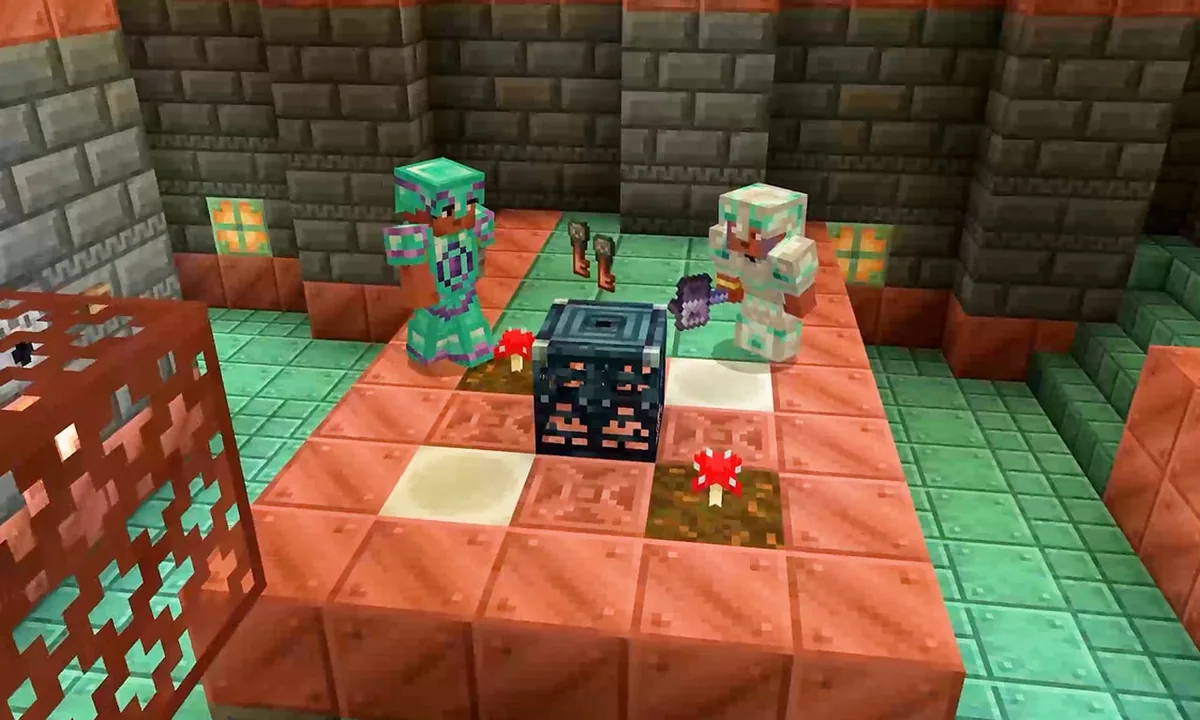 Two players beside a trial spawner and a dropped trial key