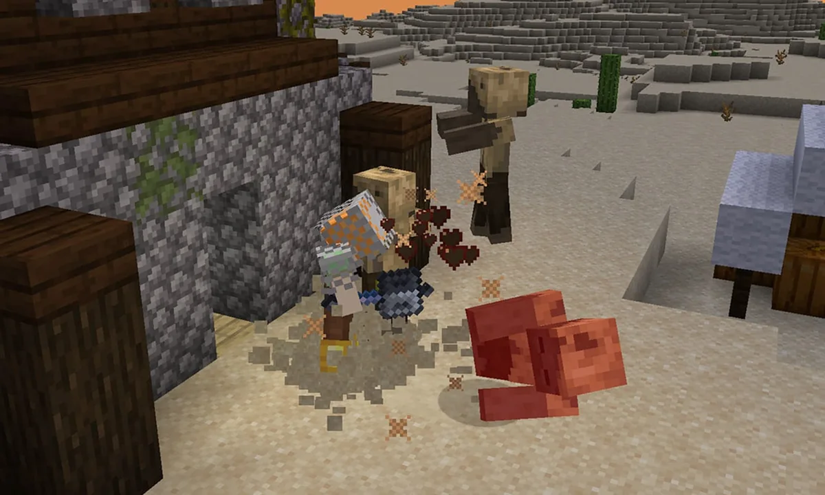A player hits a husk with a mace in a village setting