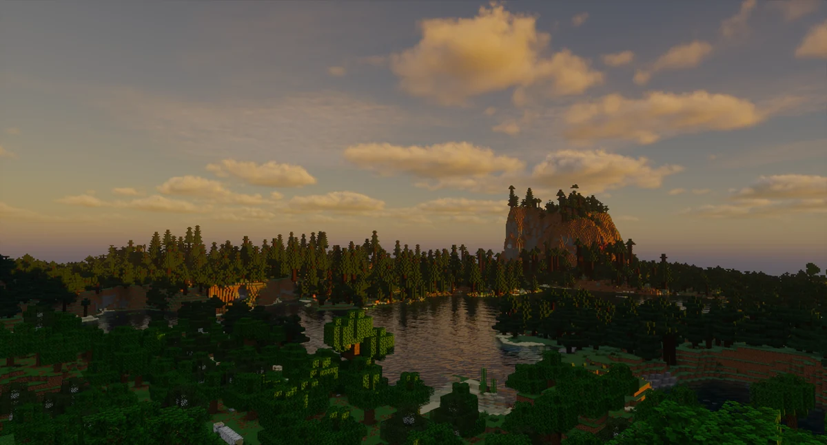 Lake reflecting a wooded landscape under Noble clouds