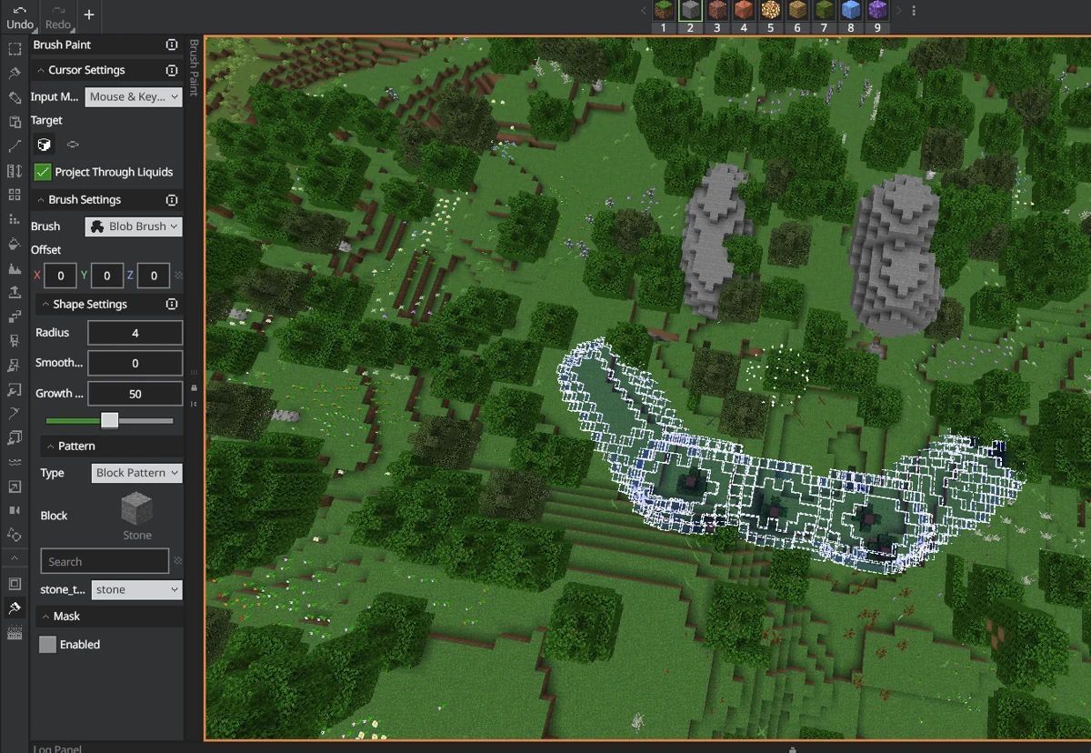 WorldEdit 0.11 beta5 Bedrock Editor brush controls showing a blob brush and rock forms in a forest